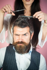 Wall Mural - Bearded man drink whiskey, sexy woman with long curly hair.