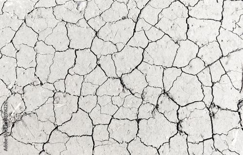 Fotomural White dried and cracked ground earth background, Close up of dry fissure ground,