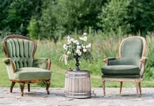 Vintage Wood Chairs And Table With Flower Decoration In Garden. Outdoor