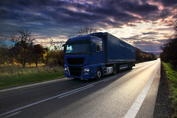 Wall Mural - Truck transportation on the road at sunset