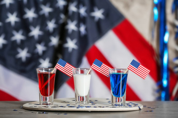 Shots with American flags on table against blurred background