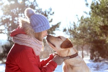 Portrait Of Woman With Cute Dog Outdoors On Winter Day. Friendship Between Pet And Owner