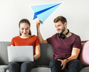 Couple with paper plane icon