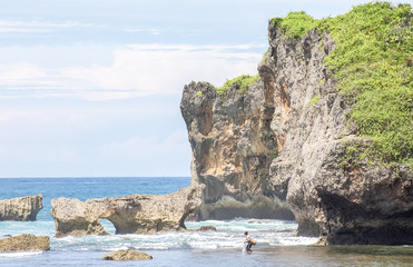 Amazing view of Yogyakarta seascape with natural coastal rock as foreground