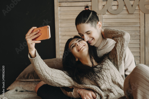 Young Couple Laying On Bed And Making A Selfie In A Cozy Room Buy 
