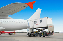 Airplane At The Airport With Loading Ladder For Disabled People. Ambulatory For People With Limited Mobility Or People In Hospitalization.