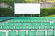 Outdoor cinema with chairs and white projection screen