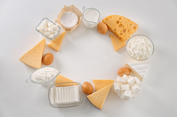 Fresh dairy products and eggs on white background