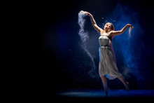 Old Fat Ballerina Tries To Dance In The Studio During Photoshoot With Flour On A Black Background