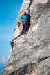 © zhukovvvlad - Girl in helmet climbs the rock.
