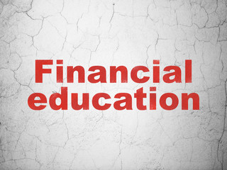 Studying concept: Red Financial Education on textured concrete wall background