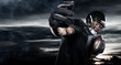 © Mike Orlov - American football sportsman player over sky background. Sports banner and wallpaper with copyspace.