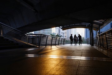 Wall Mural - Men walking in the dark