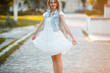 © Елена Кравчук - Smiling happiness young woman standing street, beautiful lifestyle, outdoor, walker, holding dress