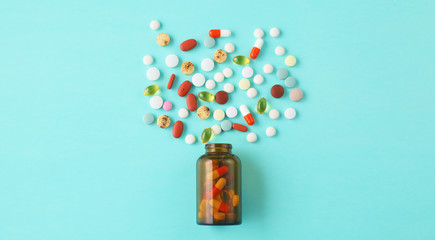 Canvas Print - Medical pills and a bottle lie on the table. Medical concept