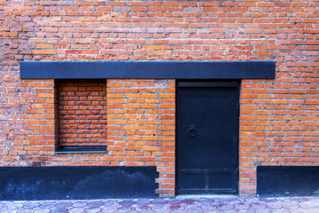 Window bricked up and a steel door