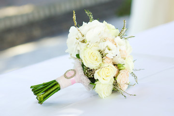 Wall Mural - tender beautiful bridal bouquet of bride lies on the table