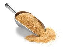 Scoop With Brown Sugar On White Background