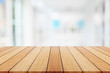 © SKT Studio - Wooden board or table and abstract blurred background. Free space can be used for photo montage or product display design and advertising