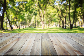 Wooden board or table and abstract blurred background. Free space can be used for photo montage or product display design and advertising