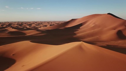 Wall Mural - aerial view on big sand dunes in sahara desert at sunrise, africa, 4k