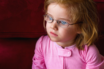 Sick Girl With Very Thick Glasses and Magnified Blue Eyes