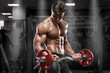 © nikolas_jkd - Muscular man working out in gym doing exercises, strong bodybuilder, abs