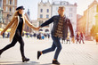 © Serhiy Hipskyy - Lovely couple run on the street and smile