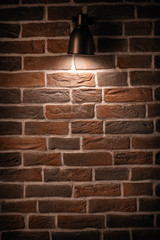 Brick wall with a lamp