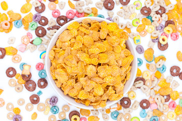 Bowl of corn flex cereals on white background