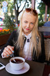 © tugolukof - woman in street cafe