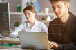 © peshkova - Man using laptop with html code