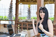 © S photographer - Business Concept.Young Asian businesswoman is working happily.Young businesswoman working in a cafe.Young businesswoman is relaxation in a coffee shop.