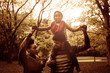 © Mladen - Happy African American family in park.