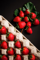 Fresh red strawberries on a black background