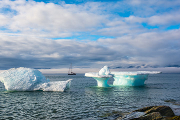 Wall Mural - ice cap near coast. yacht's anchorage in pond inlet