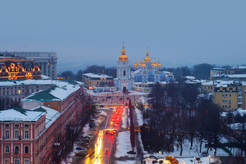 Wall Mural - Kyiv, Ukraine, with a view of the St Michaels Golden - Domed Monastery and traffic