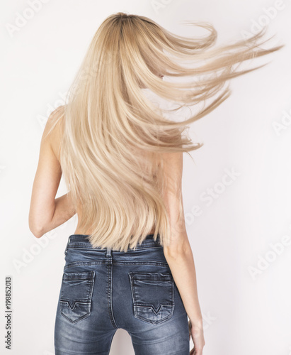 Flying Healthy Straight Long Blonde Hair Look From The Back In