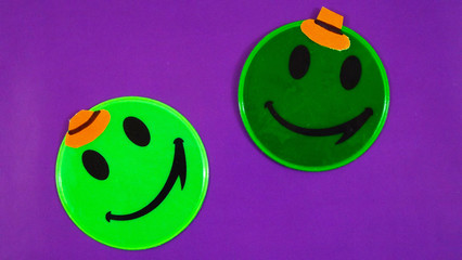 Smileys on a purple background.