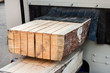 The log, sawn to the board, comes out of the sawmill.