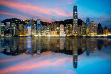 Fototapete - Hong Kong City skyline at sunrise. View from across Victoria Harbor Hongkong.