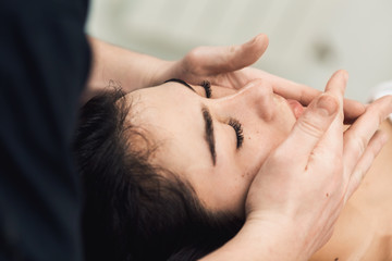 Wall Mural - Facial massage in spa. Cosmetology clinic, spa, wellness, health care concept.