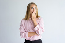 Portrait Of Young Caucasian Woman Wearing Pink Blouse Covering Mouth Afraid To Say A Word Or Keeping Secret. Secrecy Concept