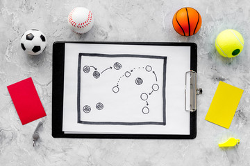 Sticker - Sport judging concept. Sport game referee. Tactic plan for game, balls, red and yellow cards, whistle on stone background top view