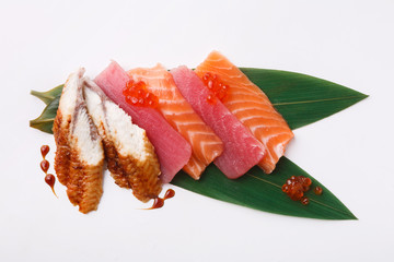 Wall Mural - Fresh fish sashimi set on bamboo leaf