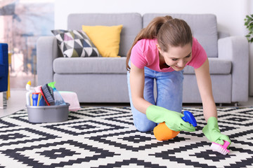 Poster - Woman cleaning carpet in living room