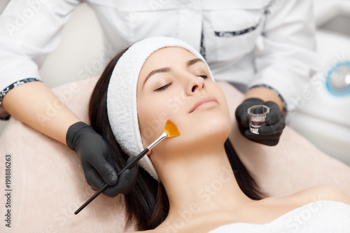 Fotografía Applying of peeling anti-acne mask on face.