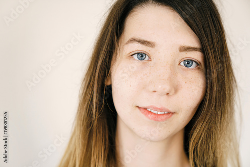 Portrait Of A Young Cute White Girl With Large Expressive Blue