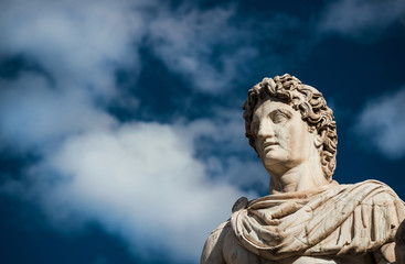Wall Mural - Ancient marble statue of Castor or Pollux, dated back to the 1st century BC, located at the top of monumental balustrade in Capitoline Hill, in Rome (among clouds)