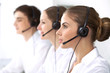 © rogerphoto - Call center. Focus on beautiful woman in headset